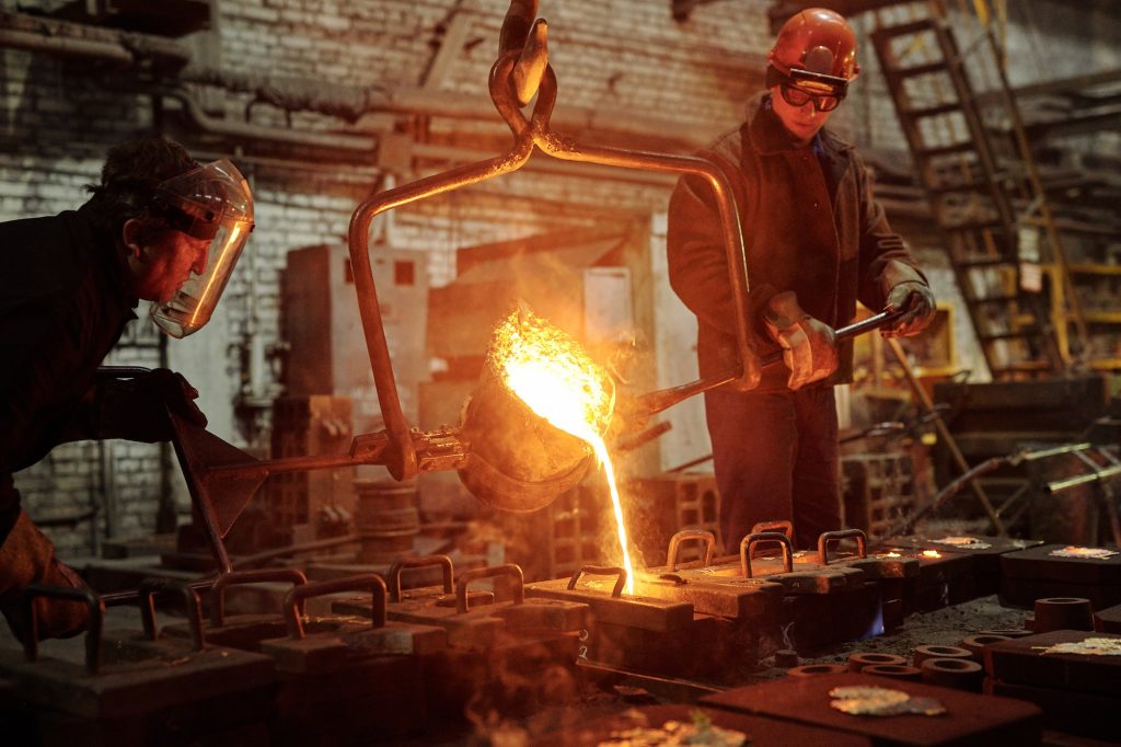 Steel workers in factory